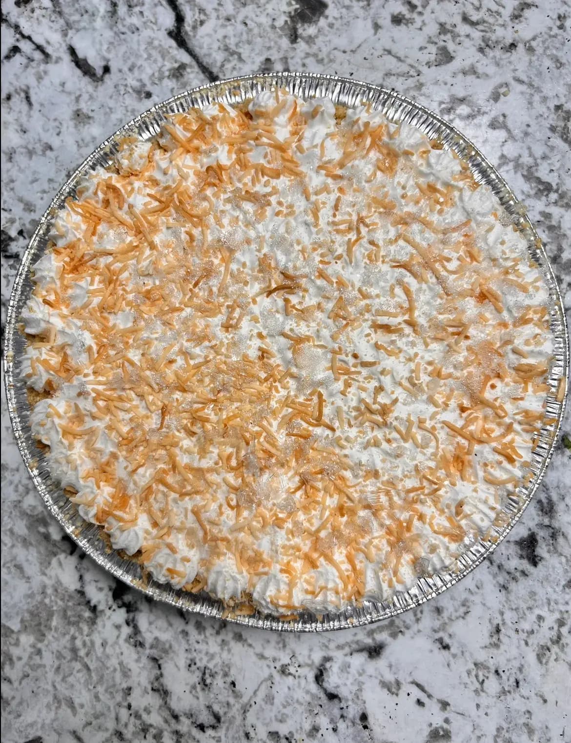 Golden lattice-top fruit pie cooling on the counter at Lewis Farms